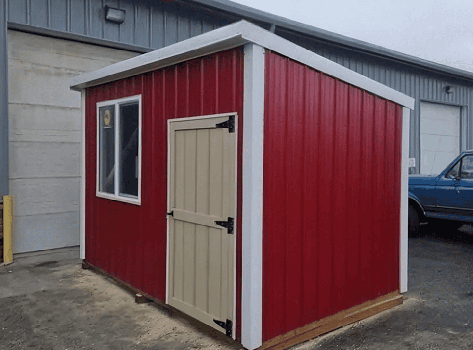 Red storage shed with white trim.